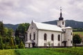 White Catholic church against the rocks in Slovakia