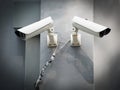 White CCTV (Closed circuit TV) camera security monitoring on cement wall