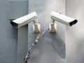 White CCTV (Closed circuit TV) camera security monitoring on cement wall