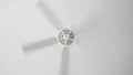 White ceiling fan on white ceiling background