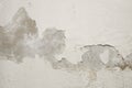 White cement wall with peeling paint. Royalty Free Stock Photo