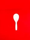 white centong and white spoon Red Background Royalty Free Stock Photo