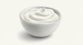 A white ceramic bowl containing smooth, creamy yogurt with a glossy texture sits against a plain, light background Royalty Free Stock Photo
