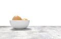 White ceramic bowl ful of eggs. Placed on concrete table. Royalty Free Stock Photo