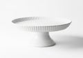 White ceramic fluted cake stand isolated on white background Royalty Free Stock Photo
