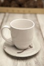 White ceramic coffee cup on ceramic hand thrown earthenware. Royalty Free Stock Photo