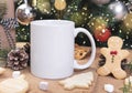 White ceramic coffee cup and christmas decoration on woon table background. mockup for creative advertising text message or