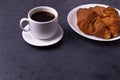 A white ceramic cup of black roasted coffee espresso and a french croissant Royalty Free Stock Photo