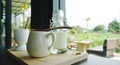 White ceramic cup on timber block