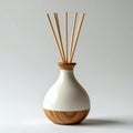 White Ceramic Diffuser Bottle With Wooden Base and Reed Sticks on Light Gray Background Royalty Free Stock Photo