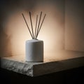 White ceramic diffuser on a textured stone surface releasing Royalty Free Stock Photo