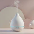 White ceramic essential oil diffuser with a teardrop shape emits a gentle stream of Royalty Free Stock Photo
