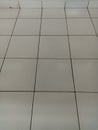 white ceramic floor. dirty floor has not been swept Royalty Free Stock Photo