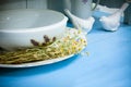 White ceramic kitchenware and chamomiles Royalty Free Stock Photo
