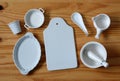 White ceramic kitchenware on wooden table - horizontal Royalty Free Stock Photo