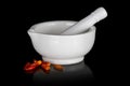 White ceramic mortar with dried chili peppers Royalty Free Stock Photo