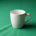 The stark contrast between the white of the mug and the rich green Royalty Free Stock Photo