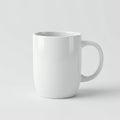 White ceramic mug with a cylindrical shape and a rounded handle. Smooth, glossy finis Royalty Free Stock Photo