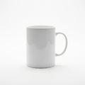 White ceramic mug with a cylindrical shape and a smooth, glossy Royalty Free Stock Photo