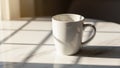 White ceramic mug on marble countertop in bright, sunlit kitchen setting Royalty Free Stock Photo