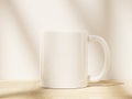 White Ceramic Mug Mock Up with Soft Shadow from Window Pane Royalty Free Stock Photo