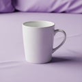 White ceramic mug with a simple handle, placed on a lavender-col Royalty Free Stock Photo