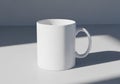 White ceramic mug with a smooth surface placed on a flat, light Royalty Free Stock Photo