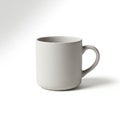 White ceramic mug with a smooth surface and a simple, rounded Royalty Free Stock Photo