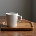 White ceramic mug on a wooden tray, positioned on a wooden table. The mug has a Royalty Free Stock Photo