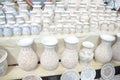 White ceramic mugs and vases.