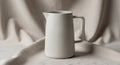 A white ceramic pitcher with a Royalty Free Stock Photo