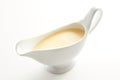 White ceramic sauce boat with Hollandaise sauce