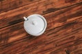 White ceramic tableware on the worktop on wooden table,