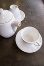 White ceramic tea pot ,cups and saucers Royalty Free Stock Photo