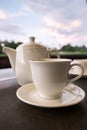 White ceramic tea pot ,cups and saucers Royalty Free Stock Photo