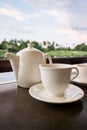 White ceramic tea pot ,cups and saucers Royalty Free Stock Photo