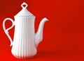 White ceramic teapot on blue background, copy space. Royalty Free Stock Photo