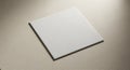 A white ceramic tile on a light-textured, beige surface. The tile is perfectly square with Royalty Free Stock Photo