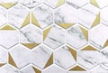 White ceramic tiles with gray stains and gold stamping. Hexagonal ceramic tile in the shape of honeycombs
