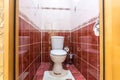 White ceramic toilet bowl in restroom Royalty Free Stock Photo