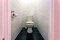 White ceramic toilet bowl in restroom Royalty Free Stock Photo