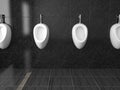 White ceramic urinals. On black tiles background. Public toilet. 3d rendering illustration