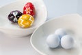 White ceramics bowls, golf balls and eggs Royalty Free Stock Photo