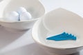 White ceramics bowls and golf balls Royalty Free Stock Photo