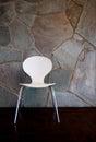White Chair by stone Wall Royalty Free Stock Photo