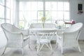 White chair and table and window sill in background