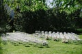 White chairs lined up for wedding ceremony. flower composition, decoration Royalty Free Stock Photo