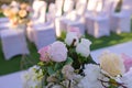 White chairs with pink bows for wedding exit registration. Royalty Free Stock Photo