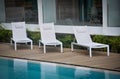 White chairs in the poolside Royalty Free Stock Photo