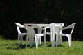 White chairs and table in lawn Royalty Free Stock Photo